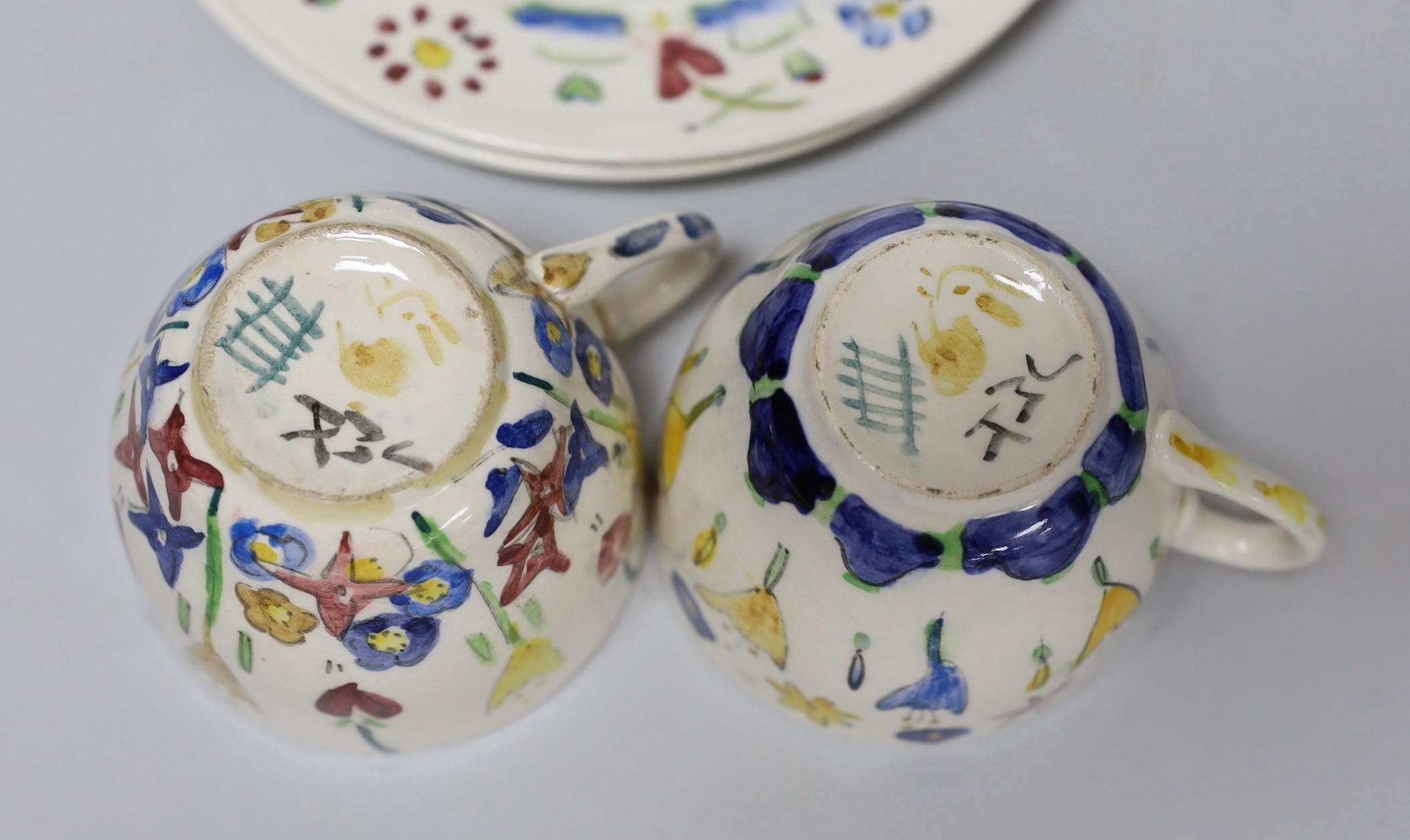 Jessie Marion King (1875-1949). Three different floral design tea cups, saucers and plates